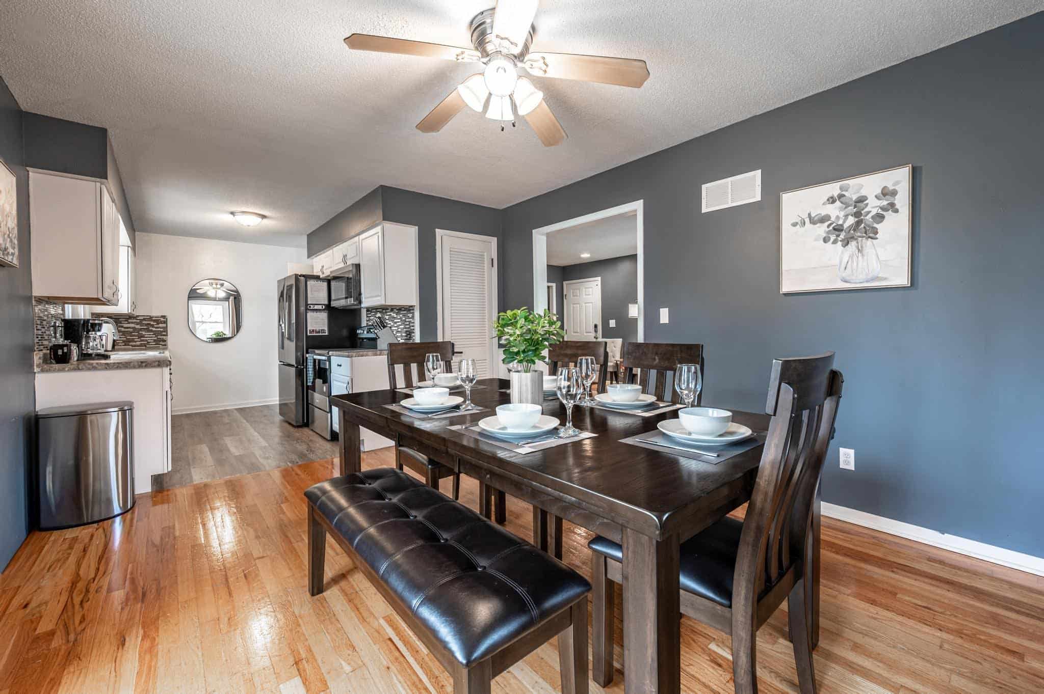 Dining Room Lees Summit Modern kitchen and dining area with hardwood floors and stylish decor.